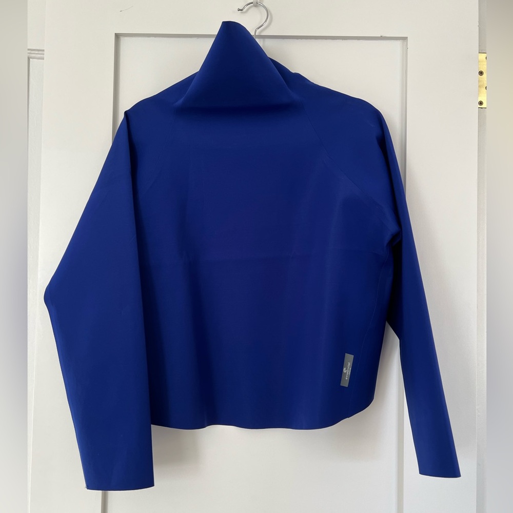 New royal blue top in performance fabric, by Evveervital, UK brand. Never worn.